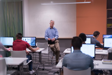 Image showing teacher and students in computer lab classroom