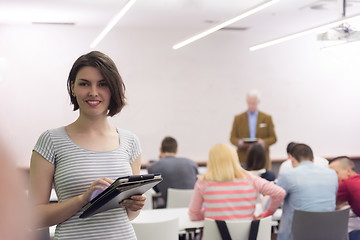 Image showing portrait of happy female student in classroom