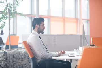 Image showing young business man  working on desktop computer