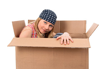 Image showing Girl hiding in a cardboard box