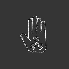 Image showing Ionizing radiation sign on a palm. Drawn in chalk icon.