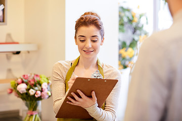 Image showing florist woman and man making order at flower shop