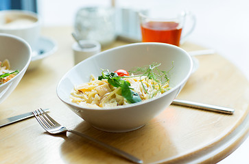 Image showing close up of pasta in bowl on table at restaurant