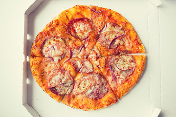 Image showing close up of pizza in paper box on table