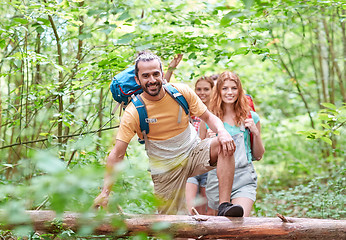 Image showing group of smiling friends with backpacks hiking