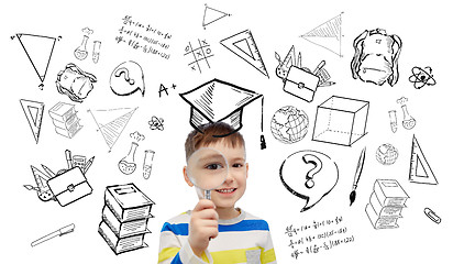 Image showing happy little boy looking through magnifying glass