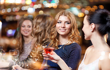 Image showing happy women with drinks at night club