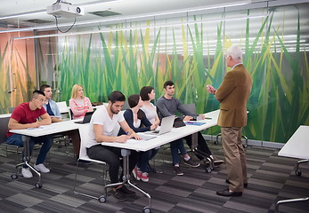 Image showing teacher with a group of students in classroom