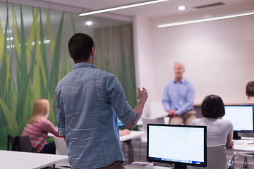 Image showing student answering a question in classroom