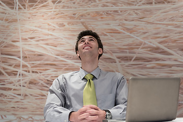 Image showing young business man  working on laptop  computer at modern office