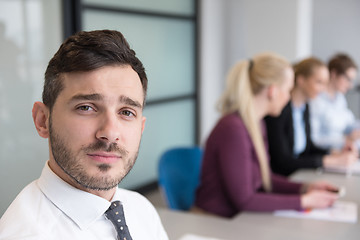 Image showing young business people group on team meeting at modern office