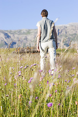 Image showing Woman in a mountain meadow