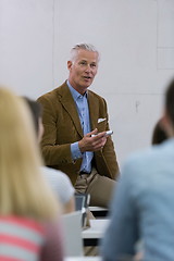 Image showing teacher with a group of students in classroom