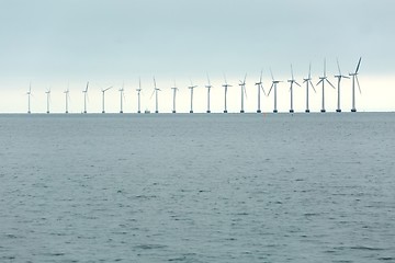 Image showing Wind tubines at sea