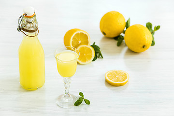 Image showing Italian traditional liqueur limoncello with lemon