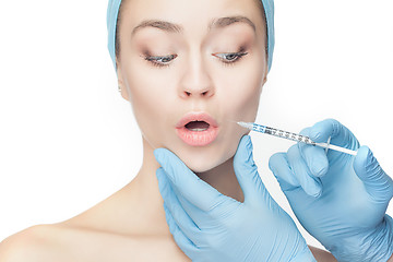 Image showing Attractive woman at plastic surgery with syringe in her face