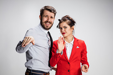 Image showing The business man and woman communicating on a gray background