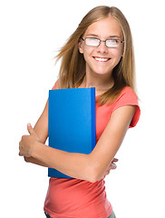 Image showing Young student girl is holding book