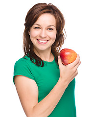 Image showing Young happy girl with apple