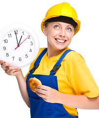 Image showing Young construction worker is going to lunch