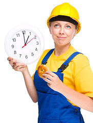 Image showing Young construction worker is going to lunch