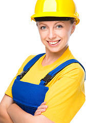 Image showing Young happy lady as a construction worker