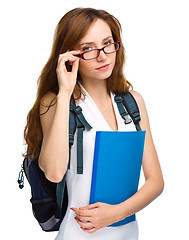 Image showing Young student girl is holding book