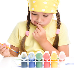 Image showing Cute thoughtful child play with paints