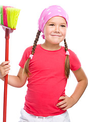 Image showing Young girl is dressed as a cleaning maid