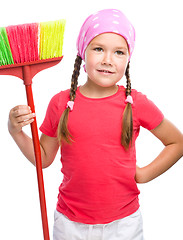 Image showing Young girl is dressed as a cleaning maid