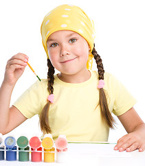 Image showing Cute cheerful child play with paints