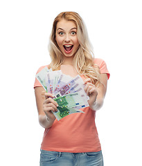 Image showing happy young woman with euro cash money