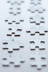 Image showing close up of puzzle pieces on table