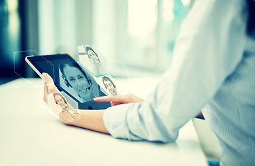 Image showing close up of woman hands with tablet pc at office
