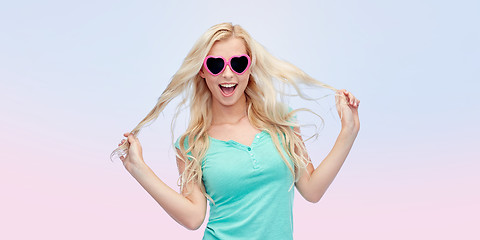 Image showing happy young blonde woman or teenager in sunglasses