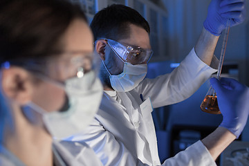 Image showing close up of scientists making test in lab