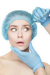 Image showing Attractive woman at plastic surgery with syringe in her face