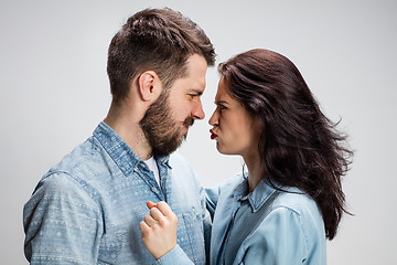 Image showing The young couple with different emotions during conflict