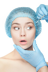 Image showing Attractive woman at plastic surgery with syringe in her face