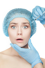 Image showing Attractive woman at plastic surgery with syringe in her face