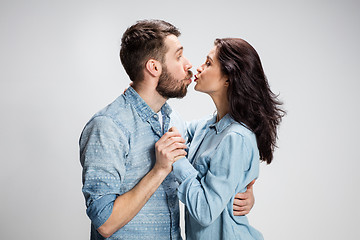 Image showing Portrait of happy couple on gray background