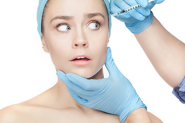 Image showing Attractive woman at plastic surgery with syringe in her face