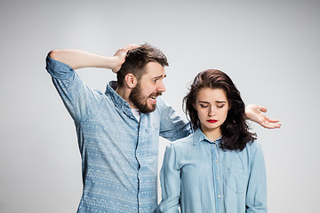 Image showing The young couple with different emotions during conflict