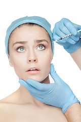 Image showing Attractive woman at plastic surgery with syringe in her face