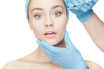 Image showing Attractive woman at plastic surgery with syringe in her face