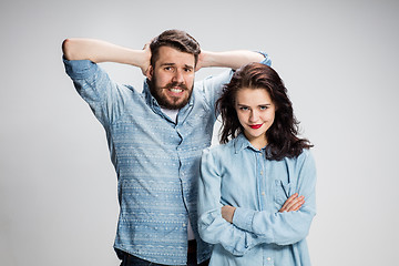 Image showing The young couple with different emotions during conflict