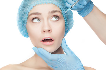 Image showing Attractive woman at plastic surgery with syringe in her face