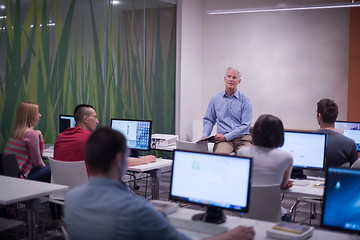 Image showing teacher and students in computer lab classroom