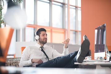 Image showing relaxed young business man at office