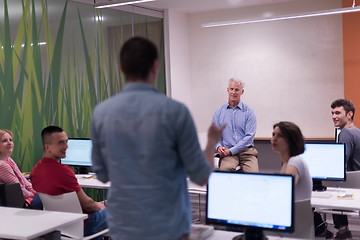 Image showing student answering a question in classroom